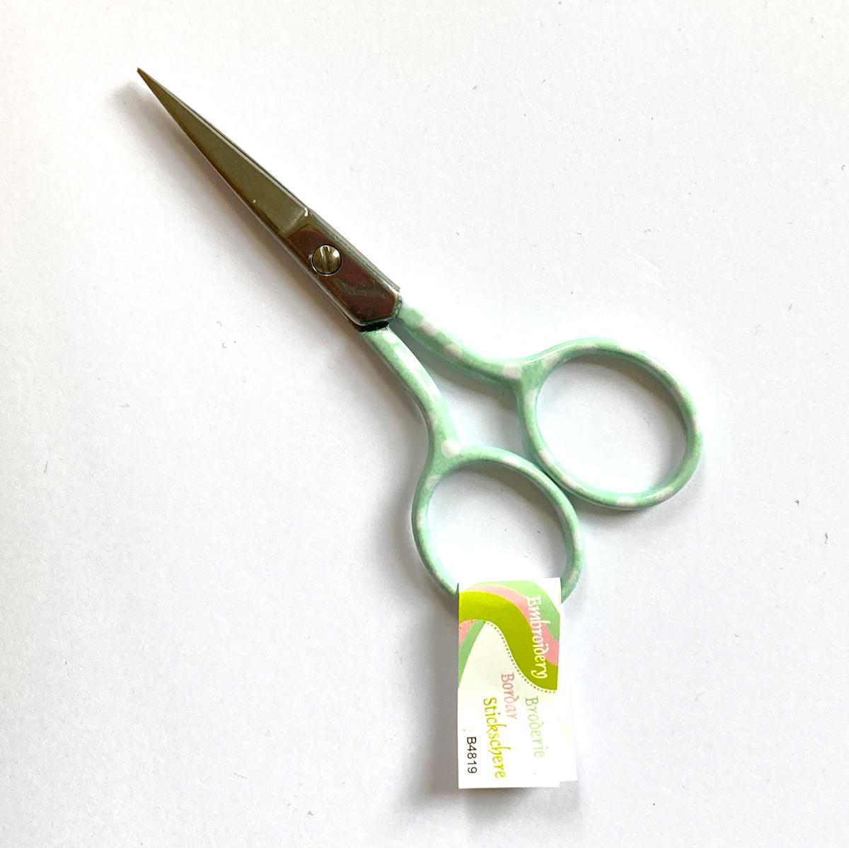 turquoise embroidery scissors with white polka dots