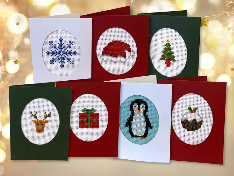 cross stitch christmas cards - snowflake, santa hat, christmas tree, reindeer, present, penguin, pudding