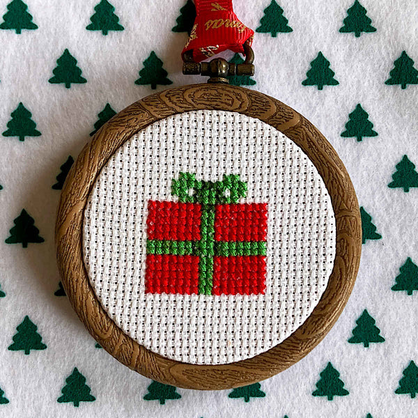 Cross stitch Gift-wrapped Christmas present with ribbon and bow in mini hoop
