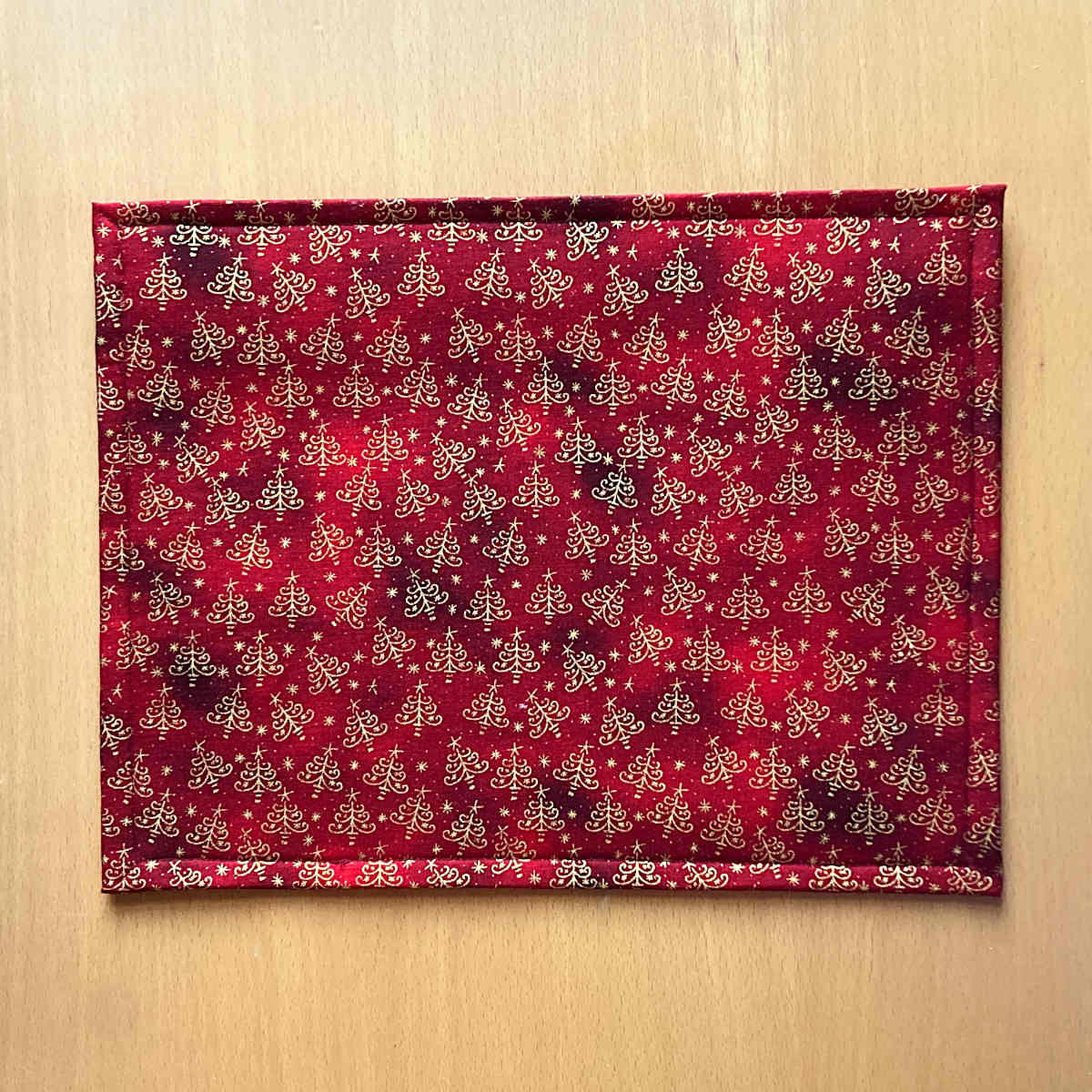 Back of Large Project Bag, showing red fabric with golden christmas tree print