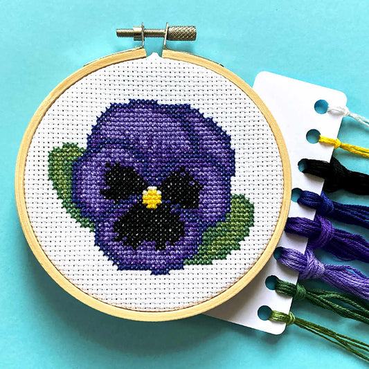 ullswater pansy cross stitch in hoop with dmc threads