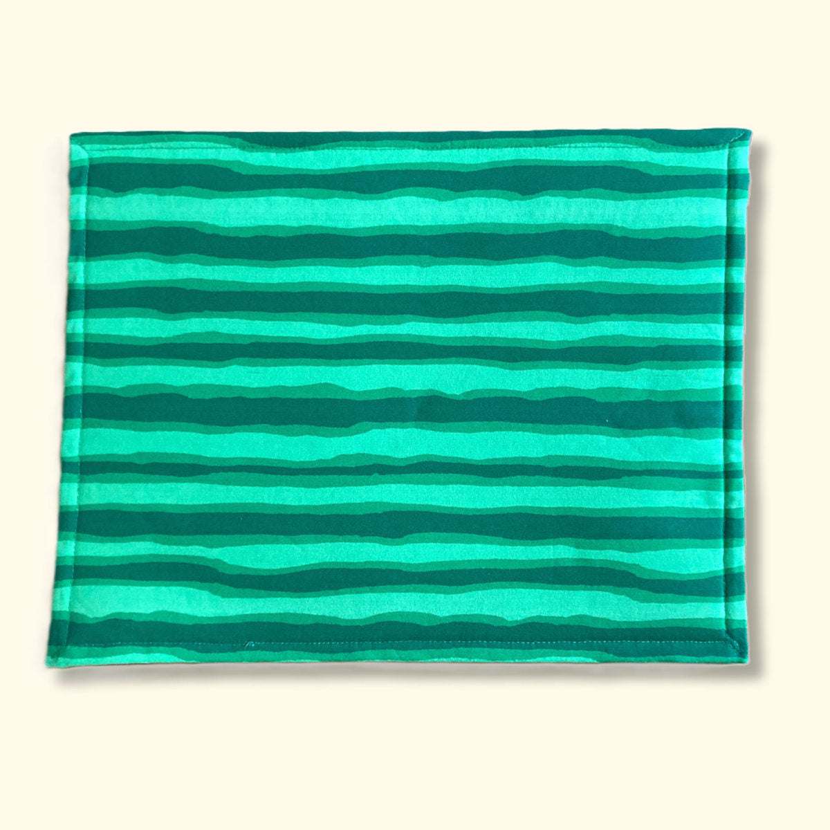 Back of watermelon project bag, green fabric with wavey dark green stripes