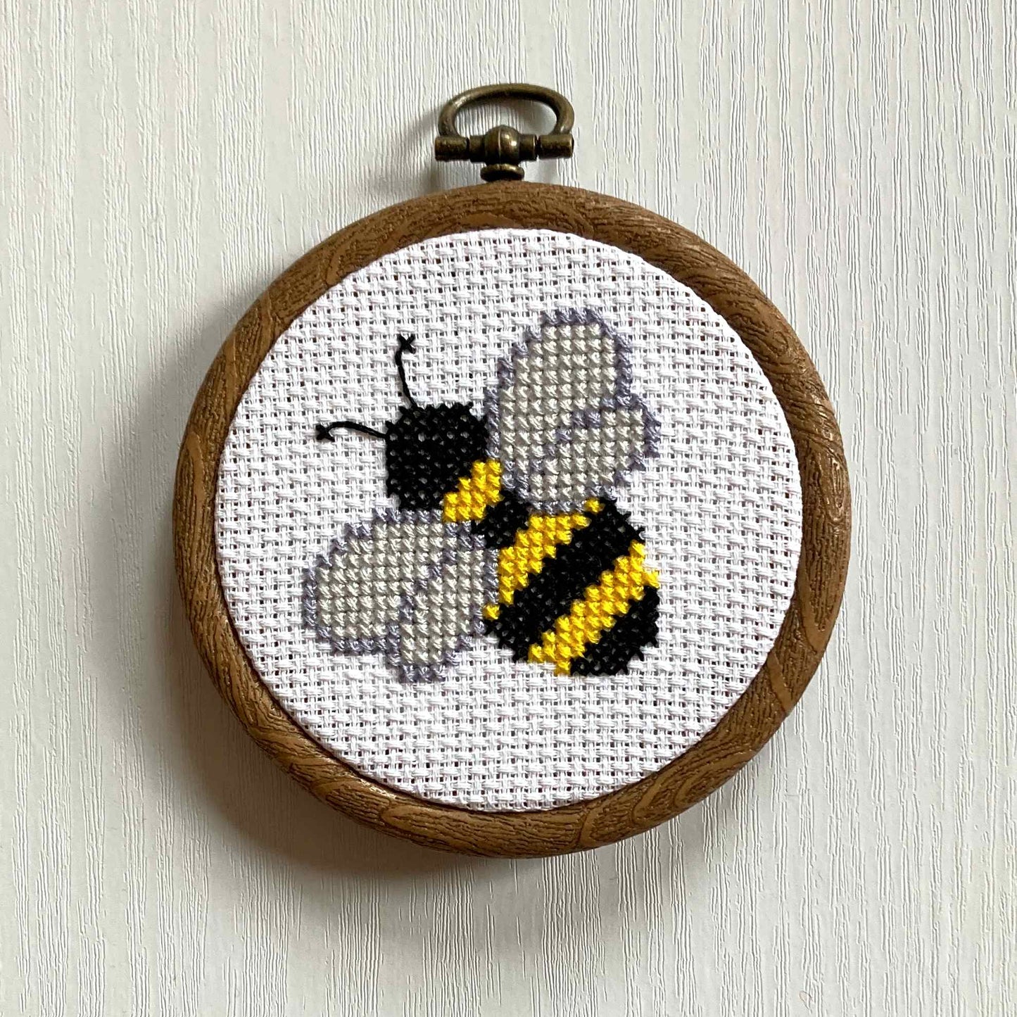 Bee cross stitch with display hoop