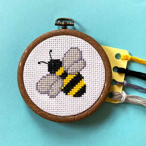 Bumblebee cross stitch in hoop with embroidery threads